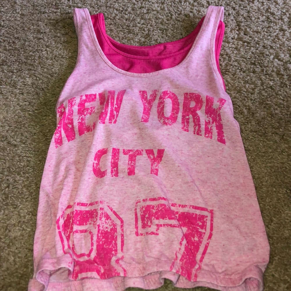 Tank top, comes with a mesh sorts bra.